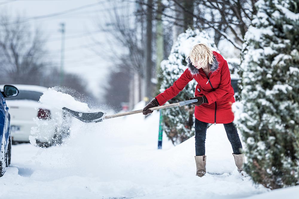 woman-shoveling-her-parking-lot-2024-09-19-06-23-18-utc.jpg