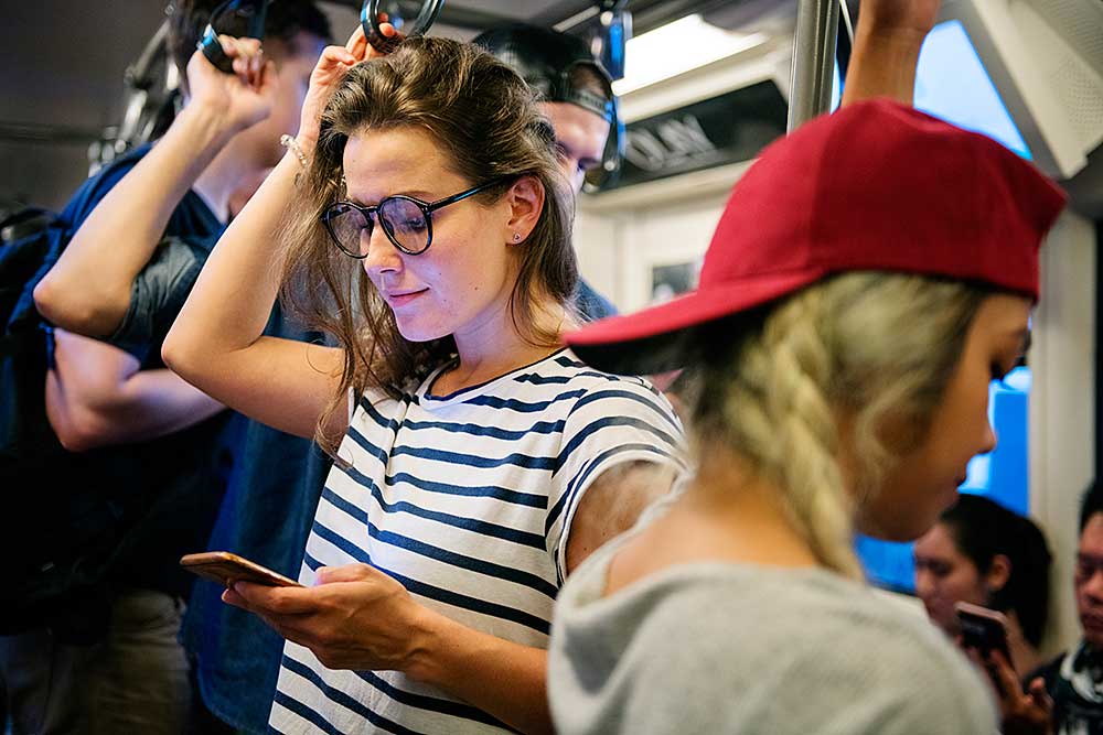 young-woman-using-a-smartphone-on-the-subway-2025-02-09-22-55-48-utc.jpg