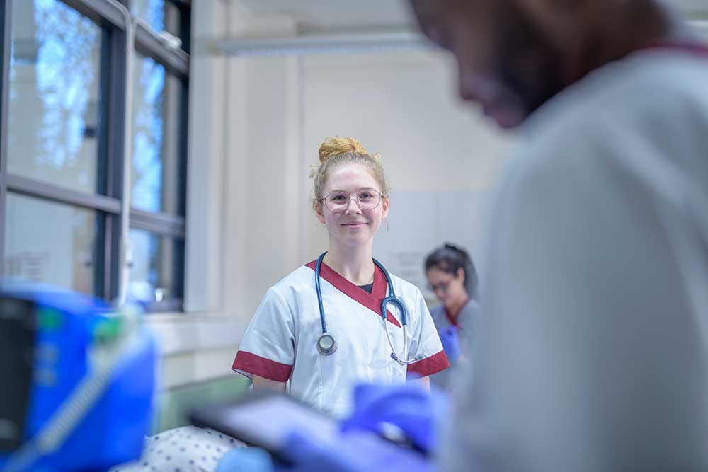 portrait-of-smiling-nurse-on-hospital-ward-2025-04-03-04-20-43-utc.jpg