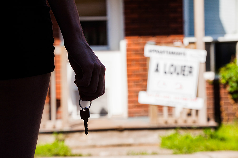 young-woman-standing-in-front-of-her-new-apartment-2024-09-18-10-59-06-utc.jpg