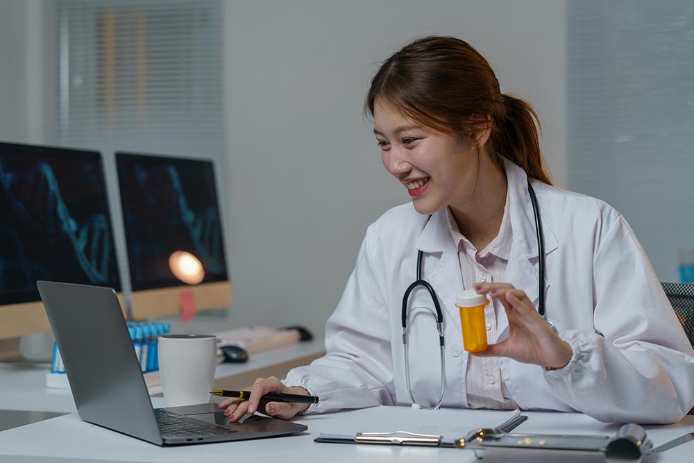 asian-female-doctor-holding-a-medicine-bottle-and-2025-02-20-03-41-58-utc.jpg