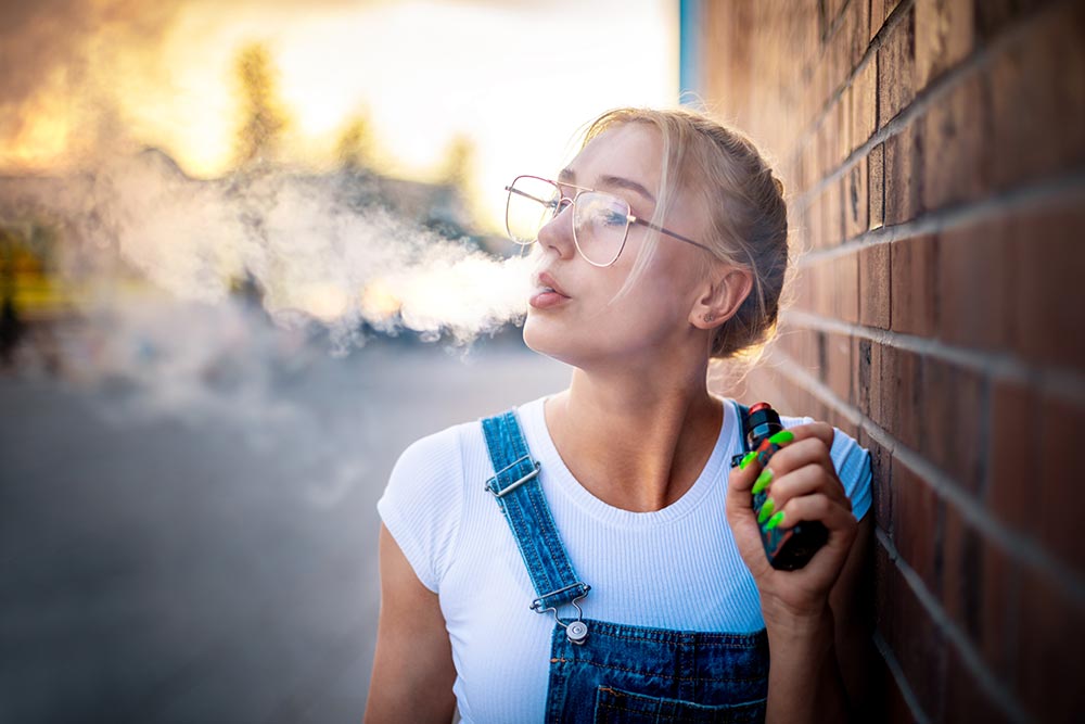 modern-girl-outdoor-smoking-vaping-electronic-ciga-2024-10-31-01-43-56-utc.jpg