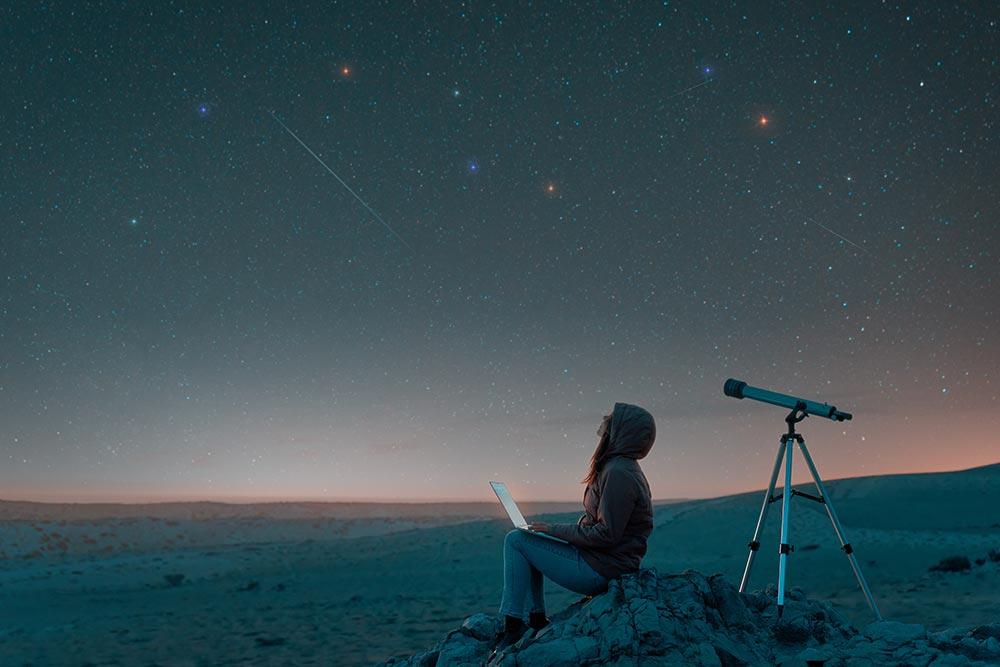 woman-sitting-in-the-desert-at-night-watching-the-2024-10-22-08-03-02-utc.jpg