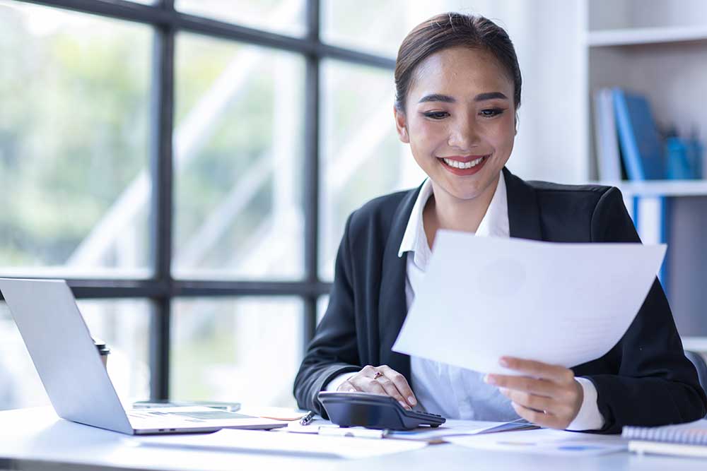 young-asian-businesswoman-sitting-at-desk-with-dat-2023-11-27-05-01-14-utc.JPG