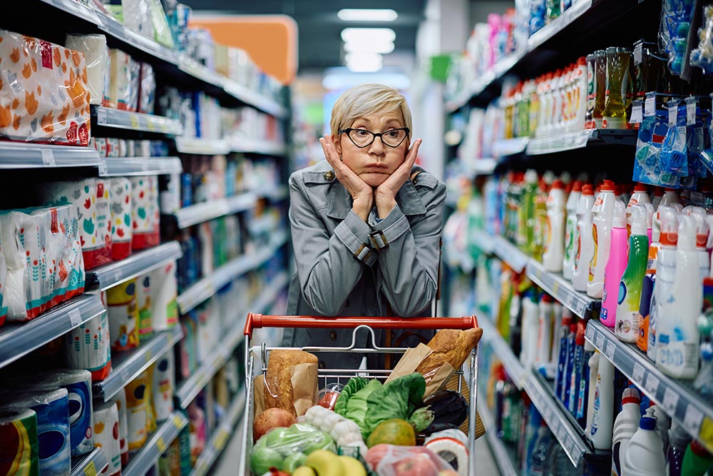 displeased-senior-woman-leaning-on-shopping-cart-w-2025-06-05-22-15-09-utc.jpg
