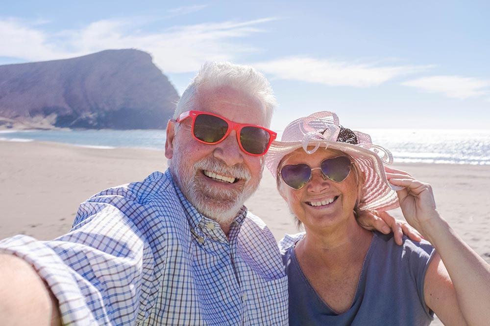 couple-of-seniors-traveling-and-taking-a-selfie-in-2025-03-07-21-03-27-utc.jpg