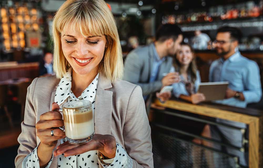 portrait-of-happy-young-business-woman-drinking-co-2023-11-27-05-14-58-utc.jpg