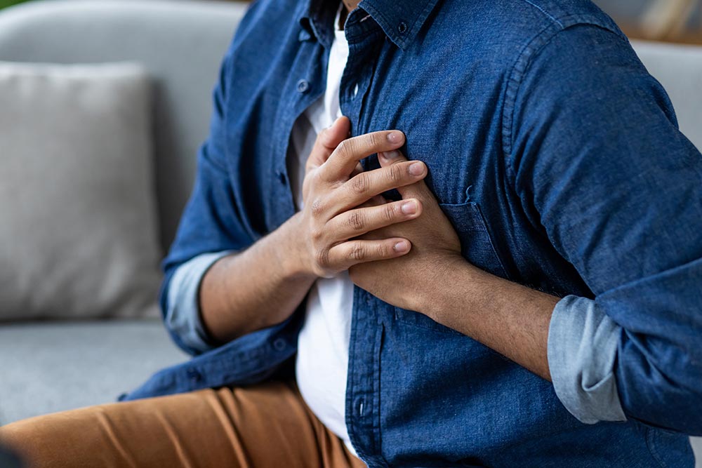 man-holding-hands-over-heart-severe-pain-heart-a-2026-01-09-07-55-40-utc.jpg