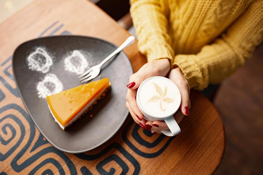 slice-of-delicious-carrot-cheesecake-and-latte-cup-2024-10-21-22-05-58-utc.jpg