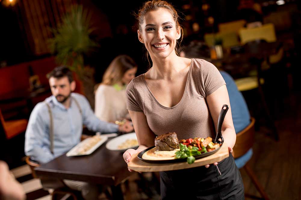 waitress-holding-a-wooden-plate-with-beef-steak-in-2023-11-27-05-16-32-utc.jpg