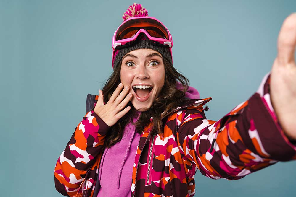 cheerful-young-woman-wearing-snowboard-gear-2023-11-27-05-12-00-utc.jpg
