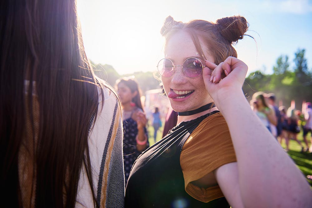 portrait-of-young-hippy-woman-in-sunglasses-at-fes-2024-11-30-22-00-32-utc.jpg