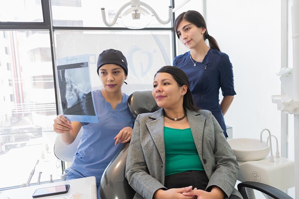 young-female-dentist-checking-x-ray-of-a-patient-2026-01-07-07-32-24-utc.jpg